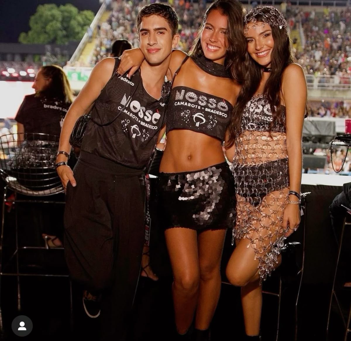 Three guests showing different ways to style official camarote shirts