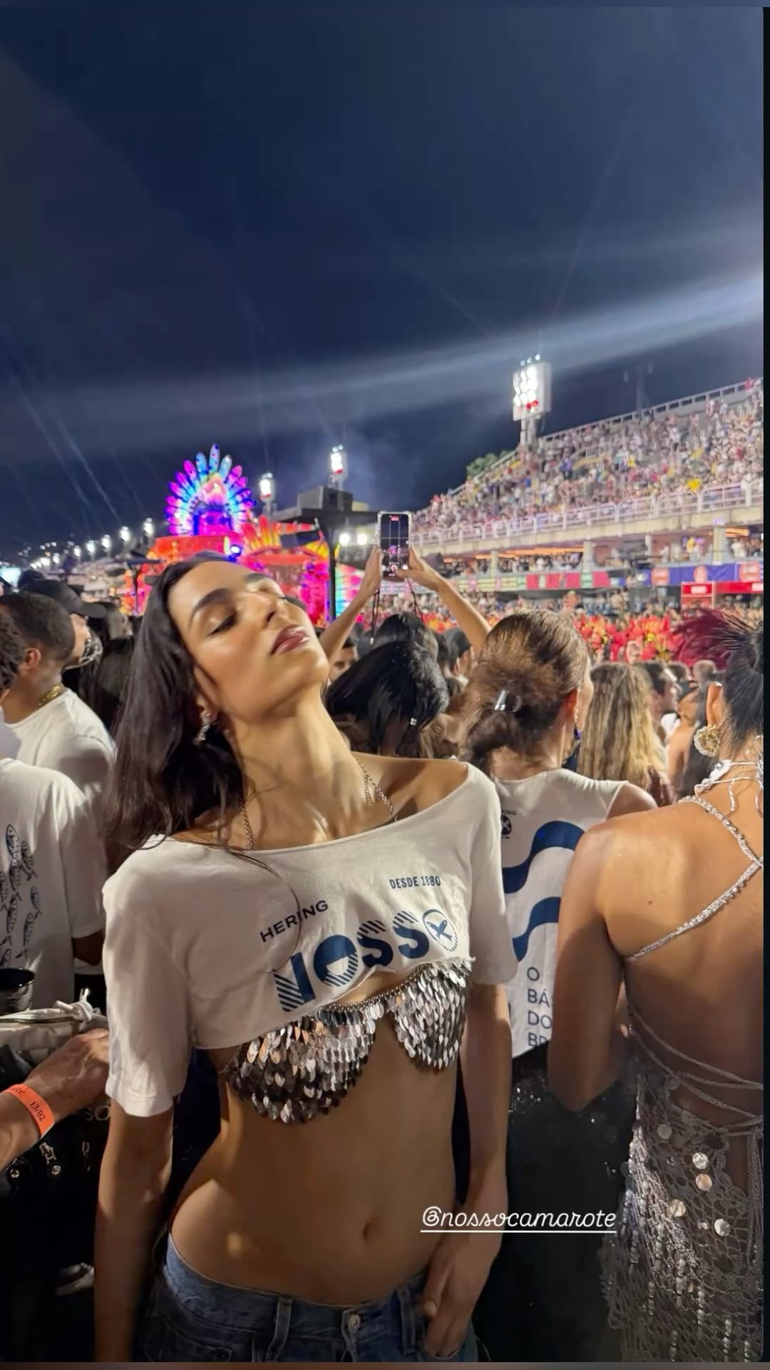 Official event shirt cropped over a sequinned top at the Sambadrome